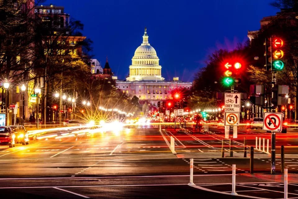 Washington, DC avenue at night with the Capitol in the background